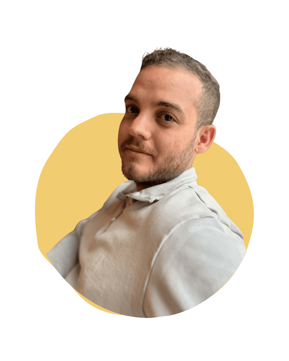 Adham, smiling, on a yellow blob